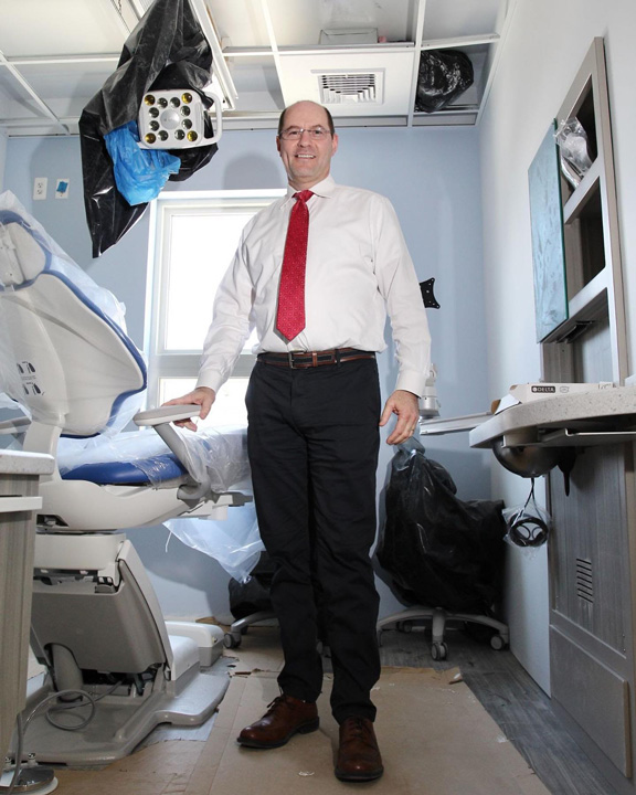 Stafford cosmetic dentist Dr. Ronen Rotem, DDS, in his practice