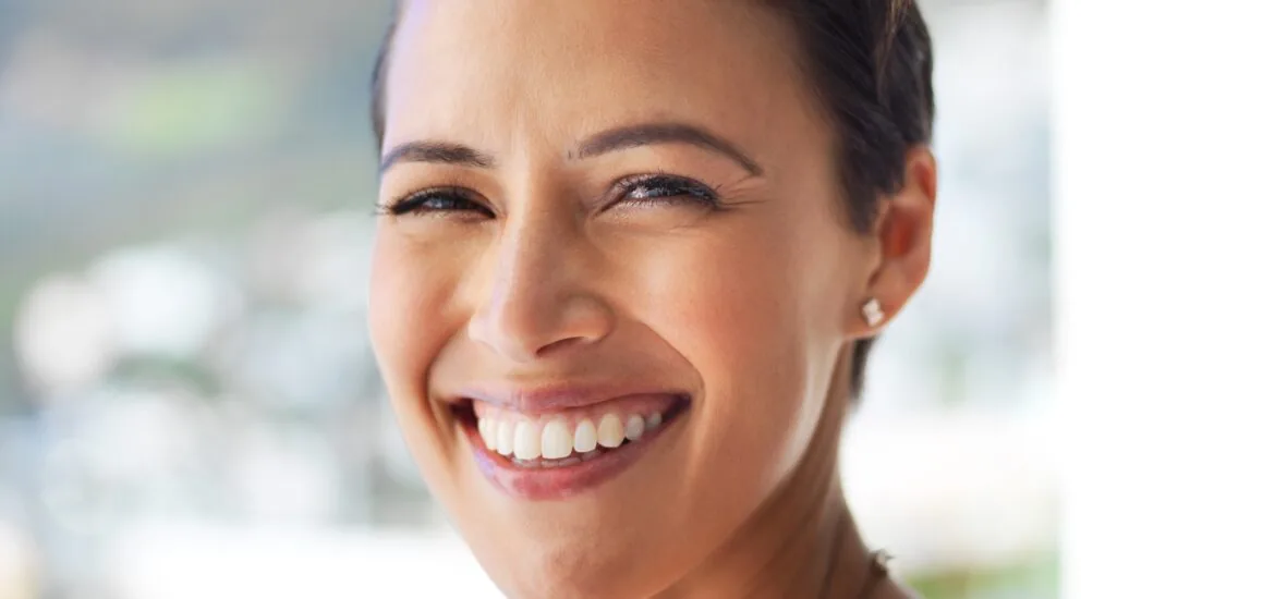 closeup of a smiling woman, new dental implants
