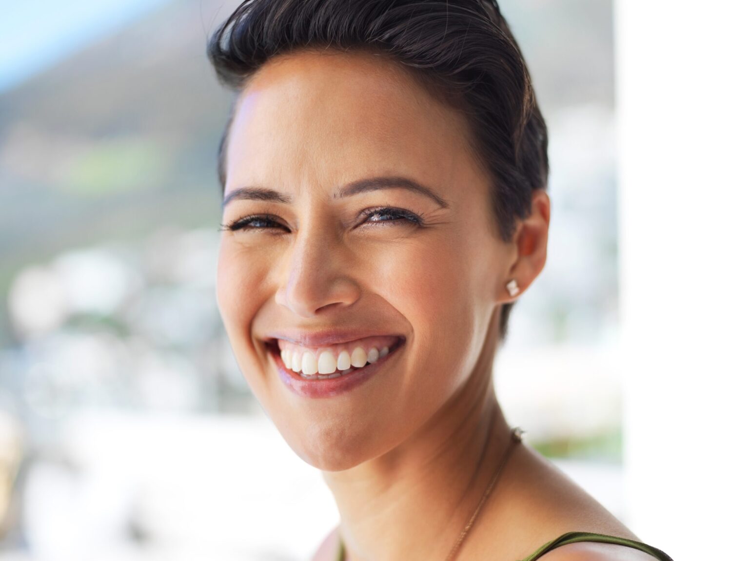 closeup of a smiling woman, new dental implants
