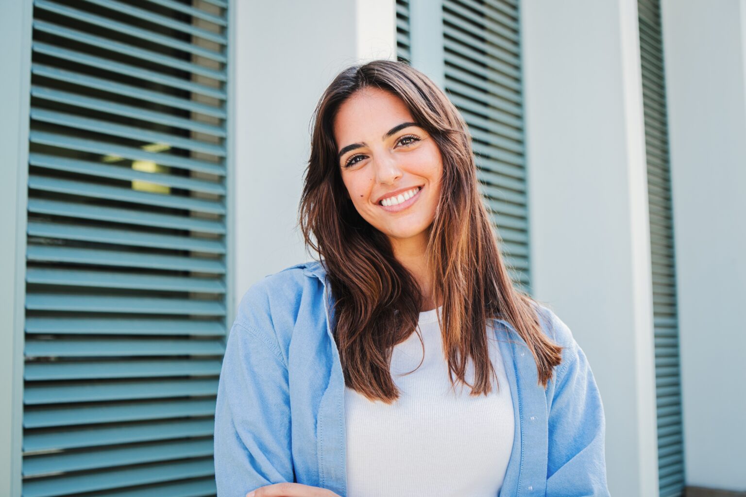 happy woman smiling outdoors, perfect white teeth